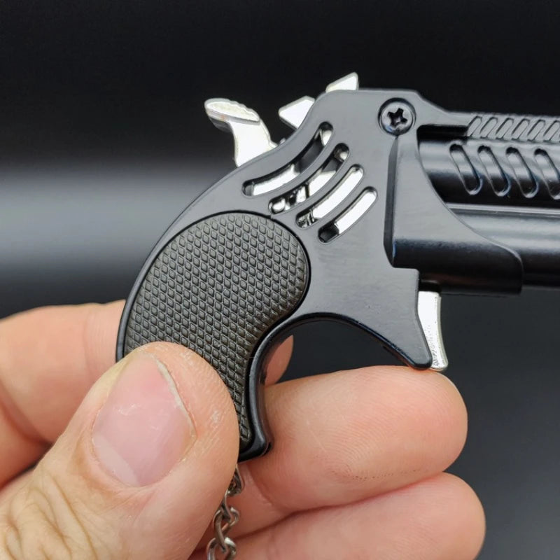 1Pcs Mini Keychain Metal Rubber Band Gun Game Toy Gun Launcher Adult Simulation Pistol Toys Gifts Pendent