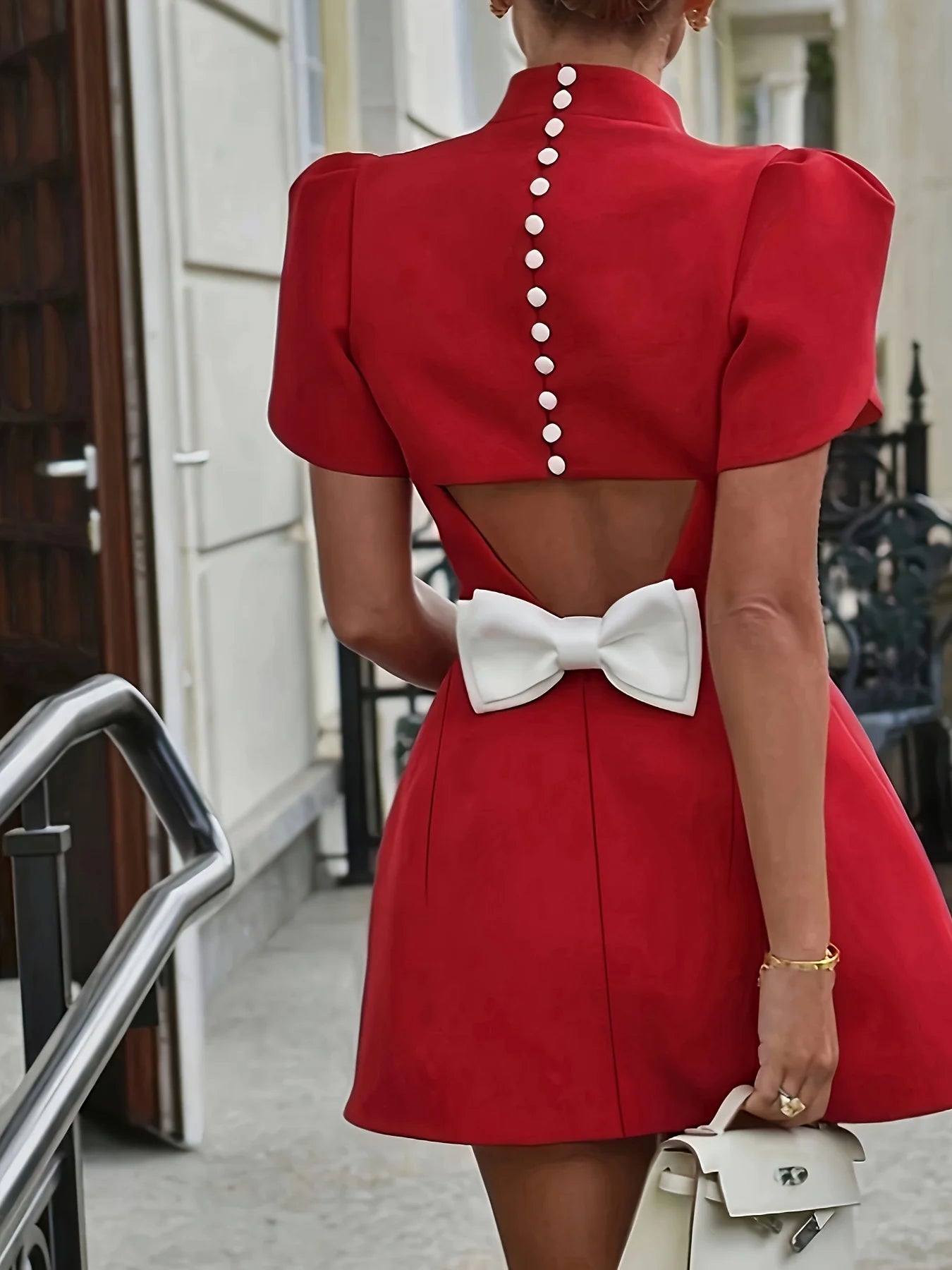 Leisure and elegant style with hollowed out bow design at the back, round neck button up women's dress, mid length skirt