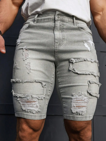 Men's Summer Denim Shorts. Light Gray Ripped Denim Shorts. Ripped and Frayed Design. Street Trend and Casual Style