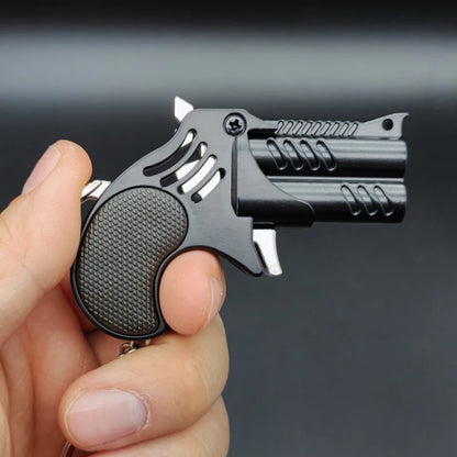 1Pcs Mini Keychain Metal Rubber Band Gun Game Toy Gun Launcher Adult Simulation Pistol Toys Gifts Pendent