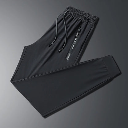 New Summer Korean Ice Silk Elastic Trousers Cool Thin Casual Men'S Loose Long Large Size Small Foot Sports Pants 8XL