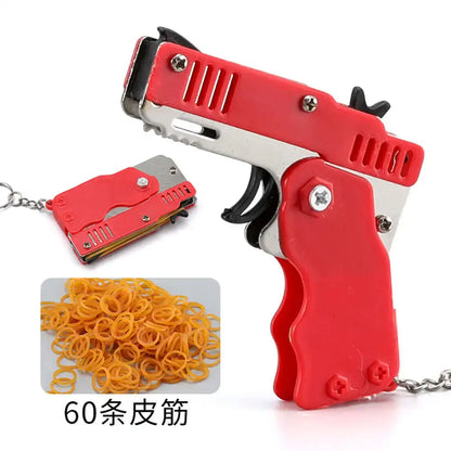 Wholesale Mini Rubber Bands Shoot Gun Alloy Material Multi Function 6 Colors Key Chain Collapsible Funny Mini Gun Toys For Kids