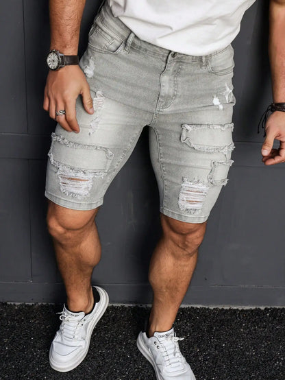 Men's Summer Denim Shorts. Light Gray Ripped Denim Shorts. Ripped and Frayed Design. Street Trend and Casual Style