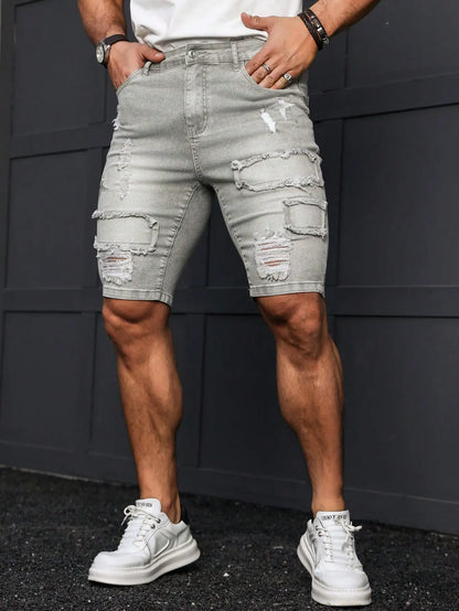 Men's Summer Denim Shorts. Light Gray Ripped Denim Shorts. Ripped and Frayed Design. Street Trend and Casual Style