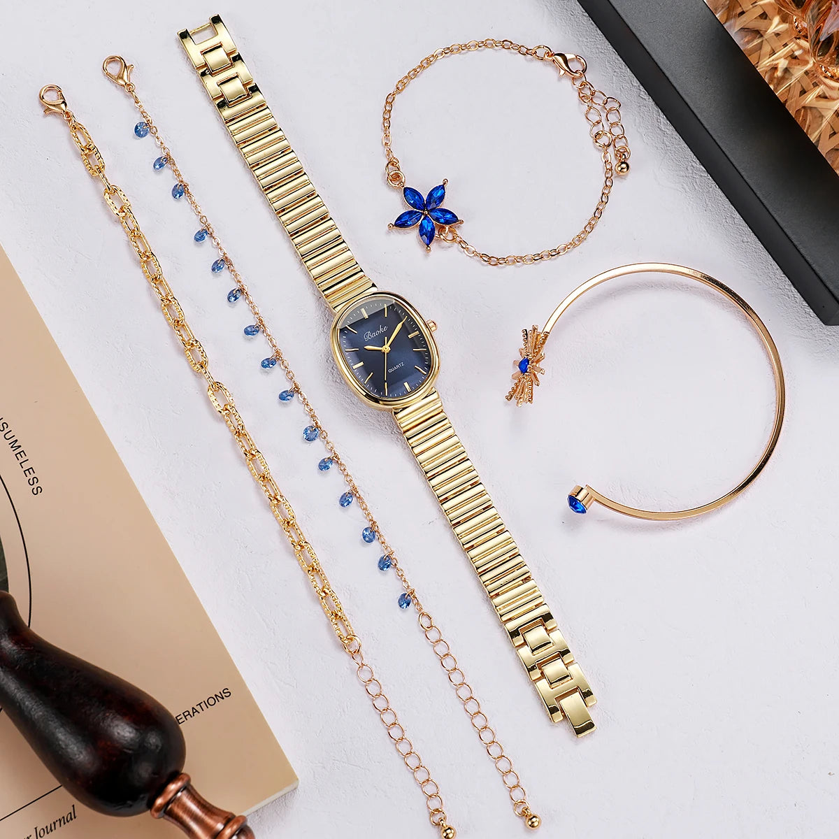 Elegant Blue Gem Gold Watch & Jewelry Set - Oval Navy Dial Quartz Watch, Starflower & Teardrop Crystal Bracelets, Sunburst & Rou