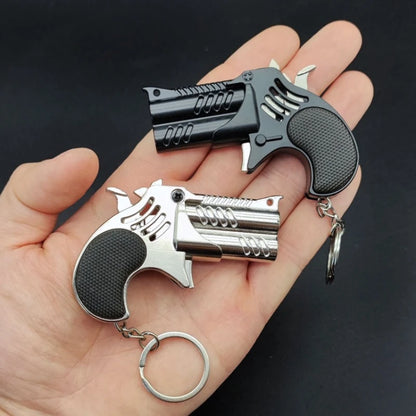 1Pcs Mini Keychain Metal Rubber Band Gun Game Toy Gun Launcher Adult Simulation Pistol Toys Gifts Pendent