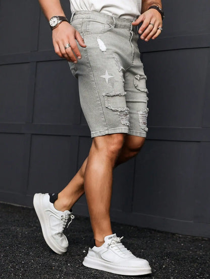 Men's Summer Denim Shorts. Light Gray Ripped Denim Shorts. Ripped and Frayed Design. Street Trend and Casual Style